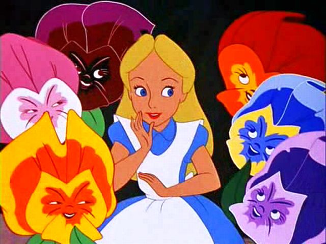an image from Alice in Wonderland showing a blond girl whispering to a group of smiling flowers