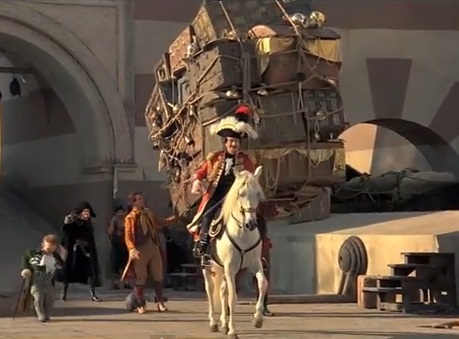 man on horse and pile of boxes and treasure; Baron Munchausen