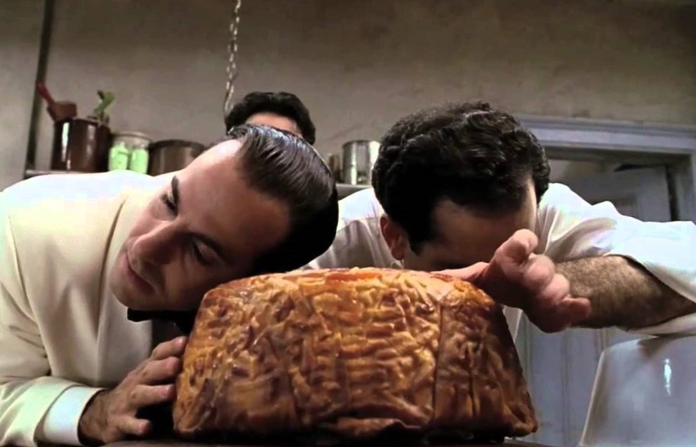 two men lean over an impressive pasta; Stanley Tucci and Tony Shaloub in Big Night