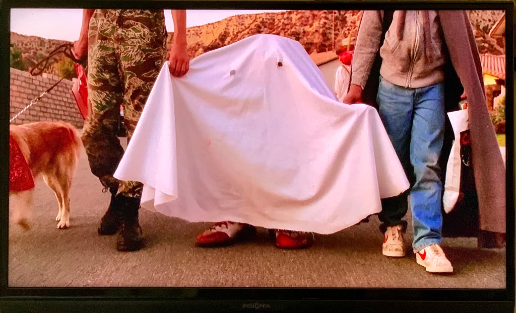 ghost costume of sheet with eye-holes; E.T.