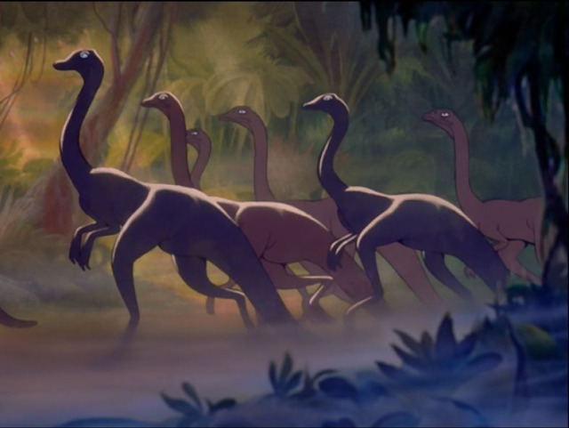 group of dinosaurs with long necks moves through mist