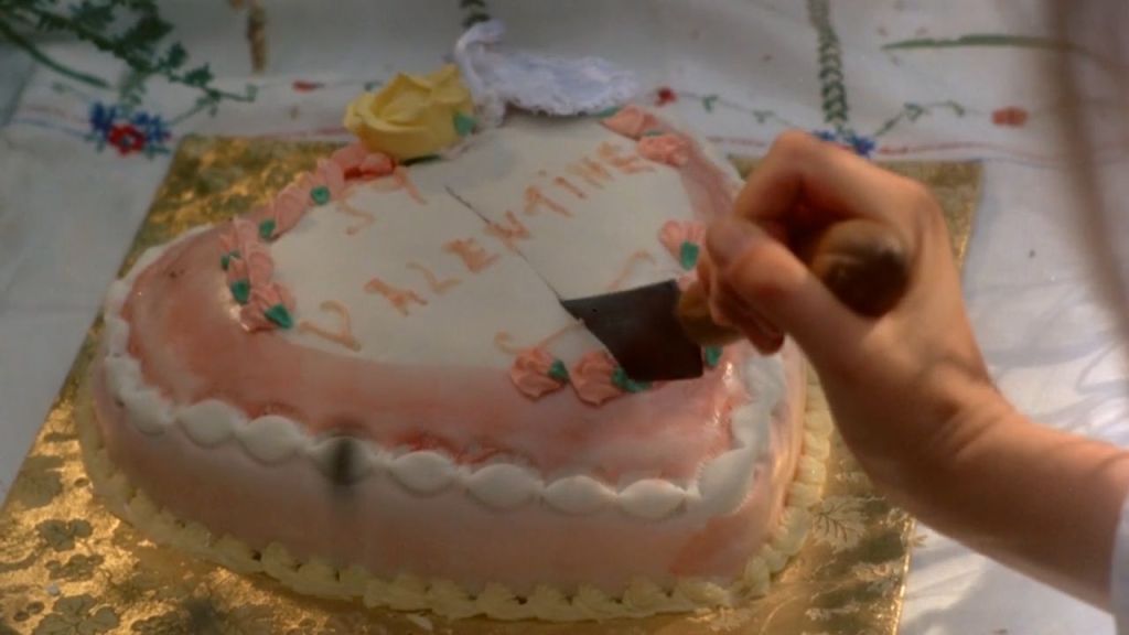 heart-shaped cake with knife going through it; Peter Weir's Picnic at Hanging Rock